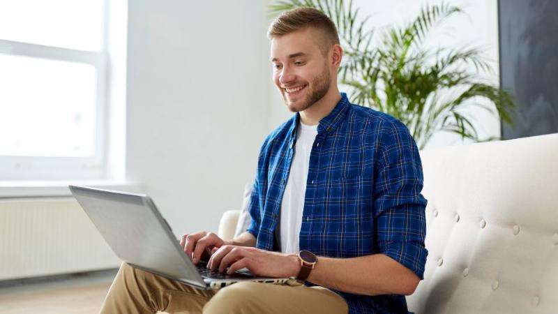 male student on laptop